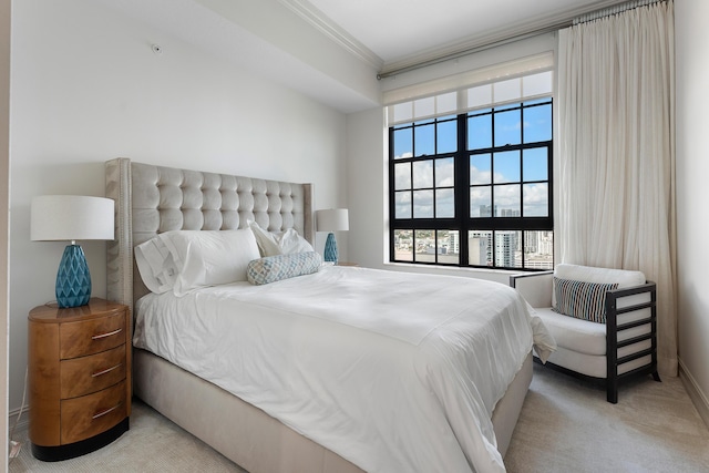 carpeted bedroom featuring ornamental molding