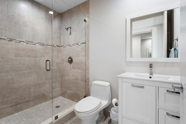 bathroom featuring vanity, toilet, and walk in shower