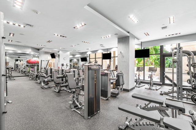 exercise room with floor to ceiling windows