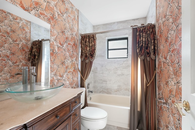 full bathroom featuring shower / tub combo, vanity, and toilet