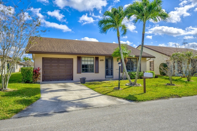 ranch-style house with a front yard and a garage