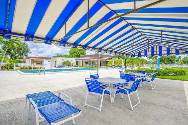 view of patio featuring a community pool