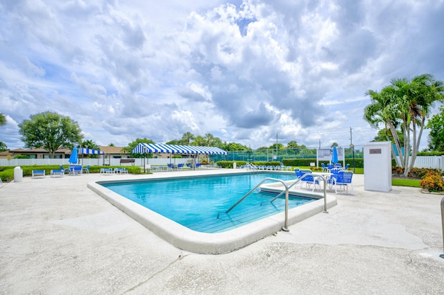 view of swimming pool featuring a patio area