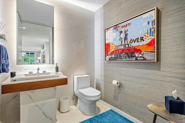 half bathroom with toilet and a sink