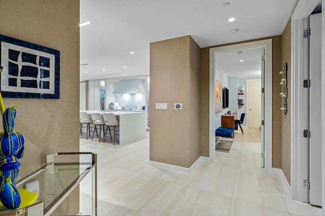 corridor featuring light tile patterned floors and recessed lighting