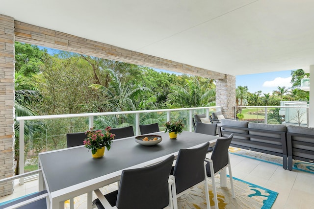 balcony featuring outdoor dining area