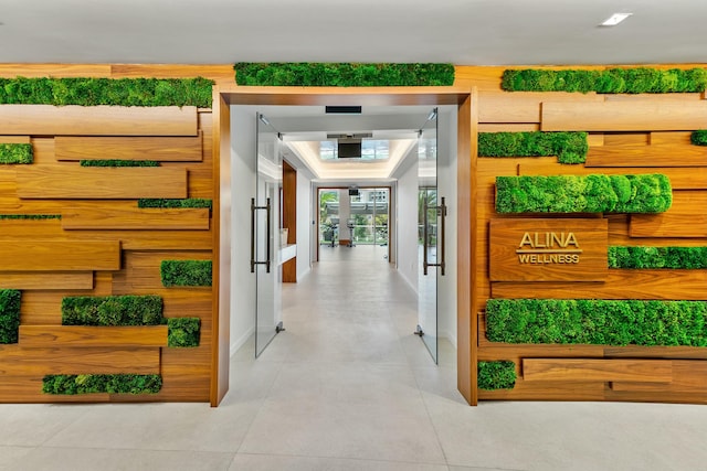 corridor featuring light tile patterned floors