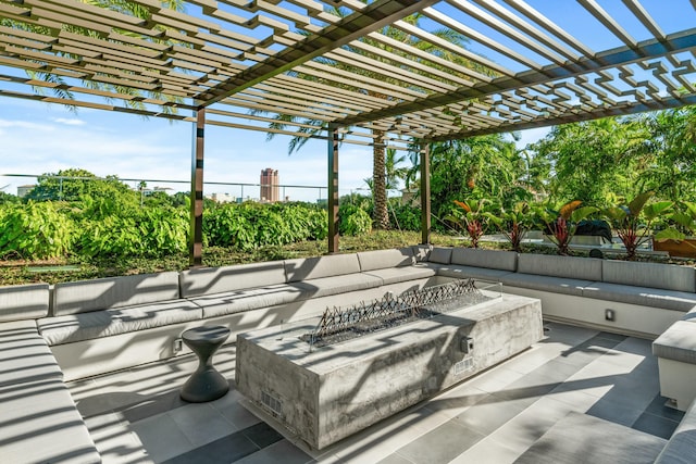 view of patio / terrace with a pergola and an outdoor living space with a fire pit