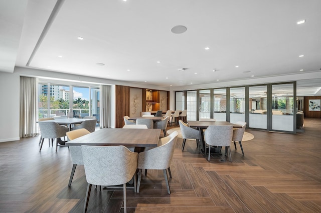 dining room featuring dark parquet flooring