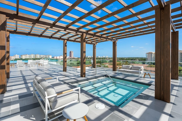 view of patio featuring a city view, a pergola, and outdoor lounge area