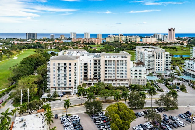 aerial view featuring view of golf course and a water view