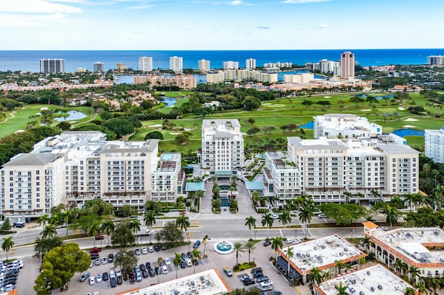 aerial view with a water view and golf course view