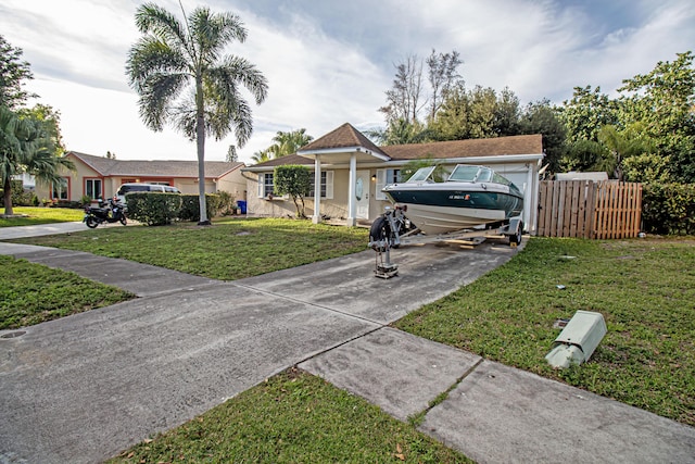 single story home with a front yard