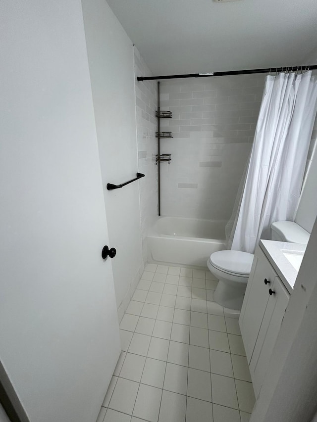 full bathroom with tile patterned flooring, vanity, shower / tub combo with curtain, and toilet