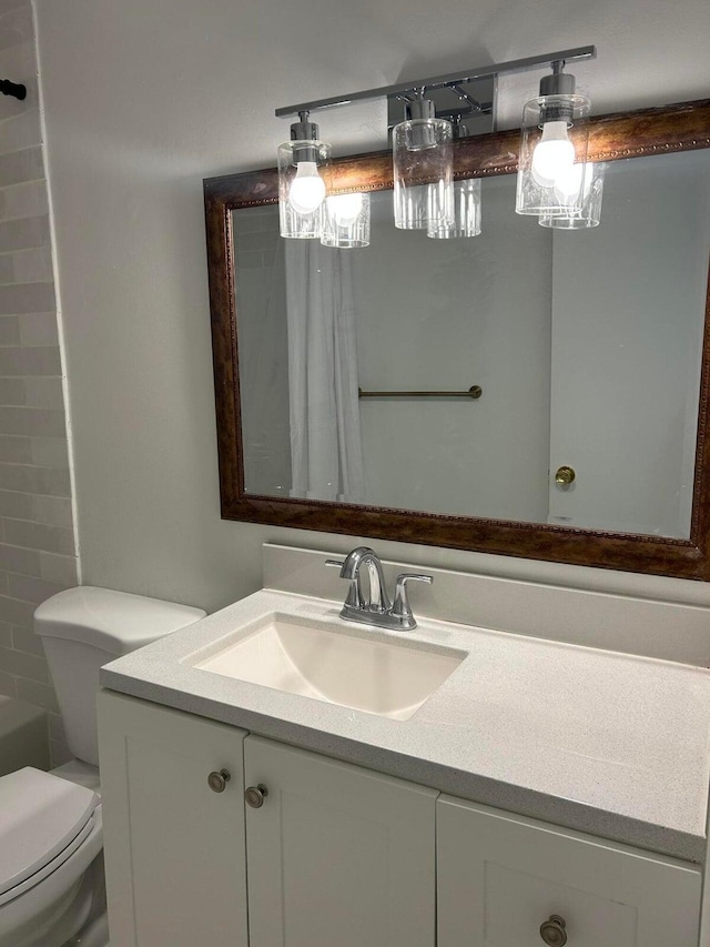 bathroom featuring vanity and toilet