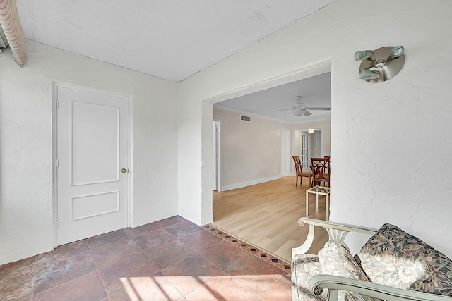 interior space featuring ceiling fan