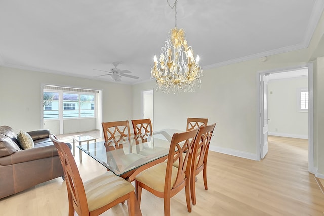 dining space with crown molding, light hardwood / wood-style flooring, and ceiling fan with notable chandelier