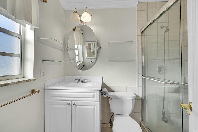 bathroom with vanity, an enclosed shower, and toilet