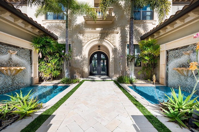 doorway to property featuring french doors