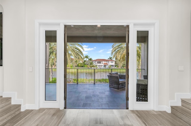 balcony featuring a water view and an outdoor hangout area