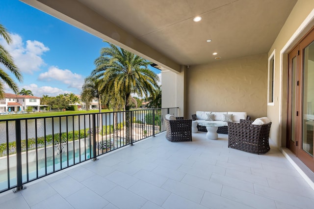 view of patio / terrace featuring an outdoor stone fireplace and french doors