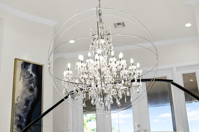 details featuring a notable chandelier and ornamental molding