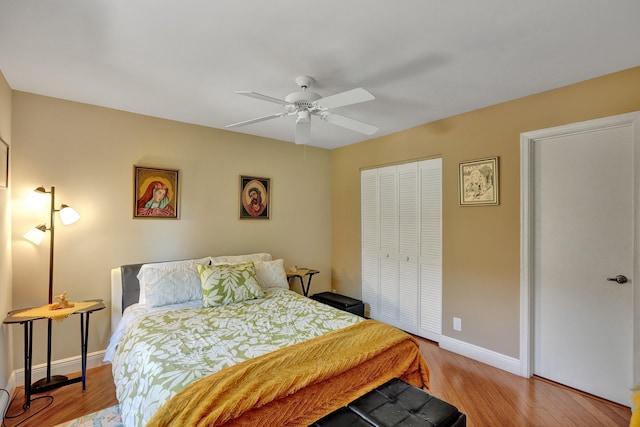 bedroom with a closet, ceiling fan, and light hardwood / wood-style floors