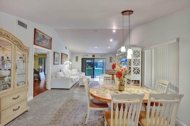 dining room featuring vaulted ceiling