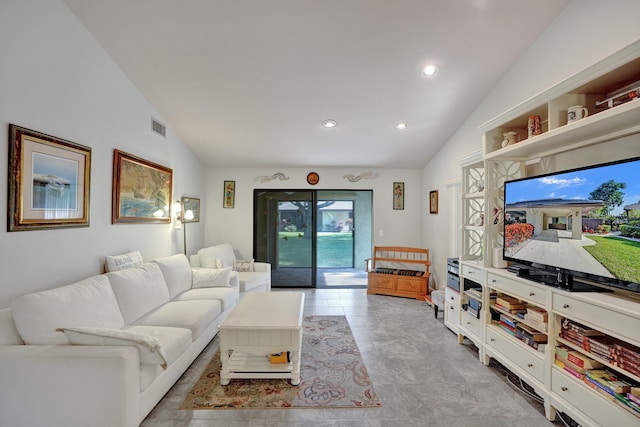 living room featuring vaulted ceiling and light tile patterned floors