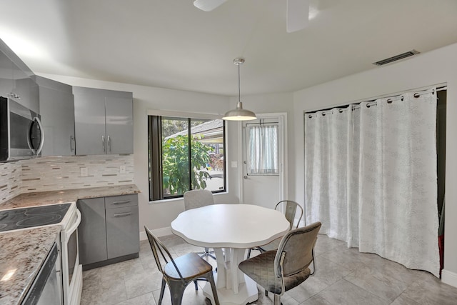 dining area featuring light tile patterned floors