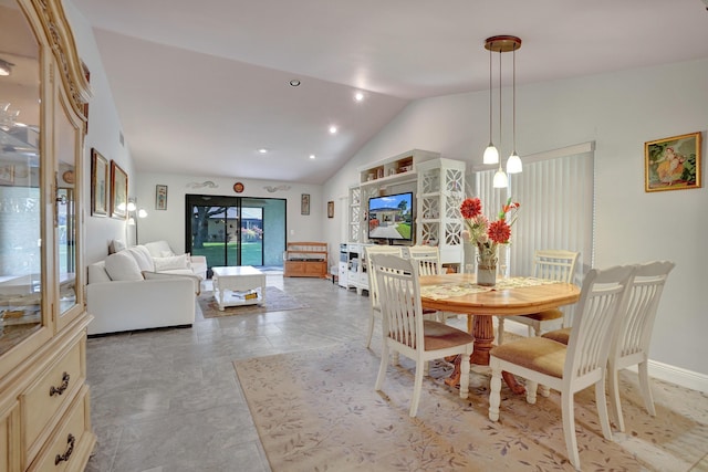 dining area with lofted ceiling