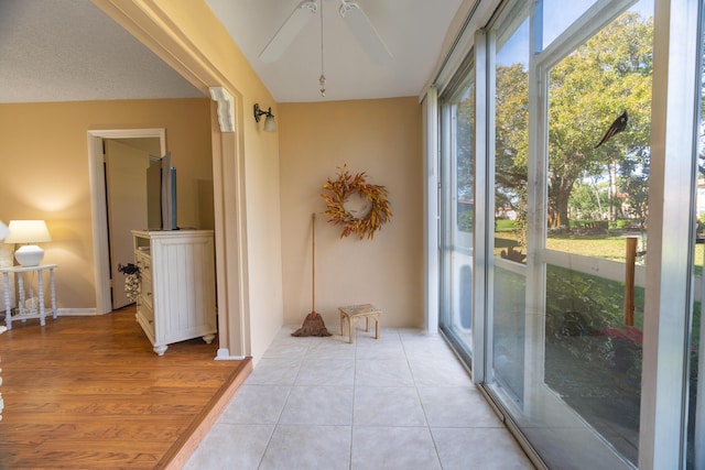 interior space featuring ceiling fan