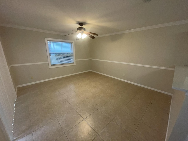 unfurnished room with ceiling fan and crown molding