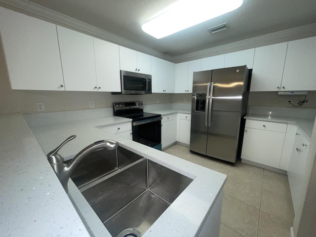 kitchen featuring crown molding, white cabinetry, sink, and stainless steel appliances