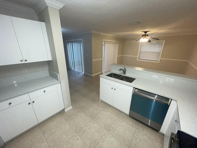 kitchen with white cabinetry, sink, ceiling fan, stainless steel dishwasher, and a textured ceiling