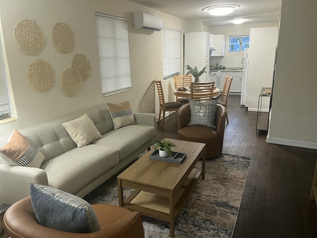 living room with dark hardwood / wood-style flooring and a wall mounted AC