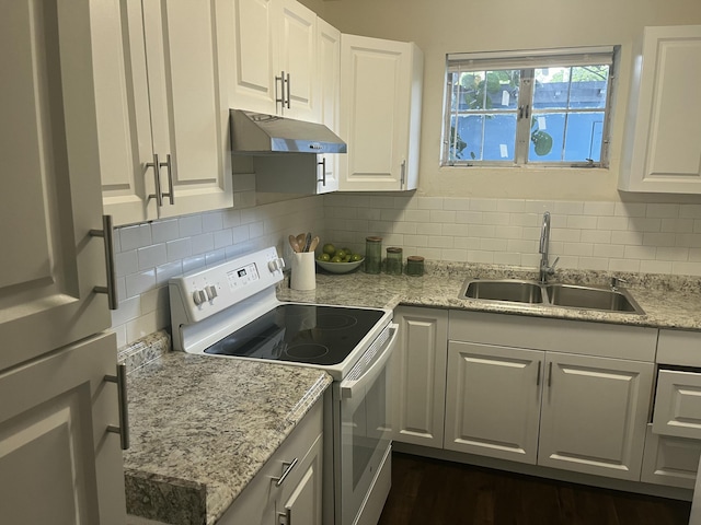 kitchen with backsplash, sink, white cabinets, and white electric range oven