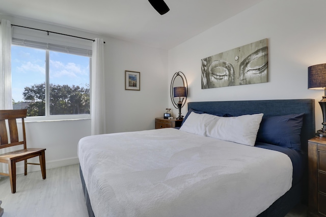 bedroom featuring light hardwood / wood-style floors and ceiling fan