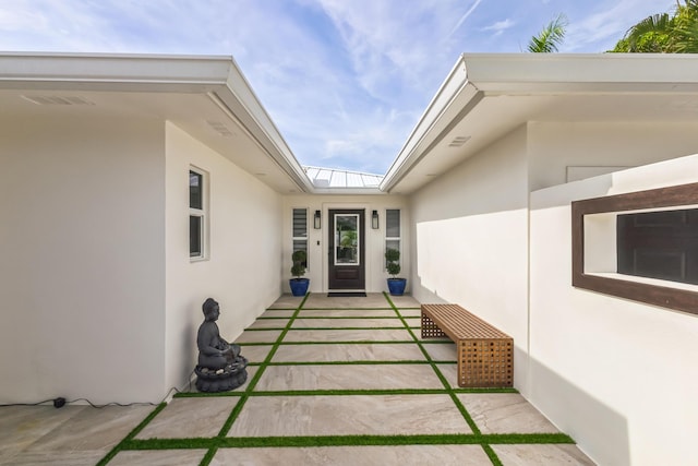 entrance to property with a patio