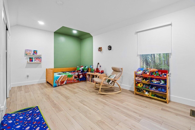 recreation room with hardwood / wood-style floors