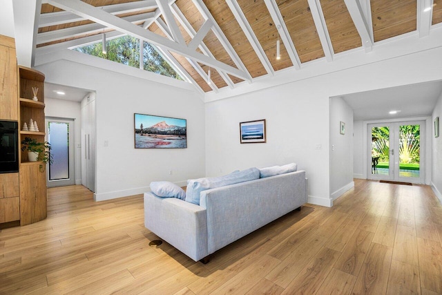 living room with light hardwood / wood-style flooring, high vaulted ceiling, wood ceiling, and beamed ceiling