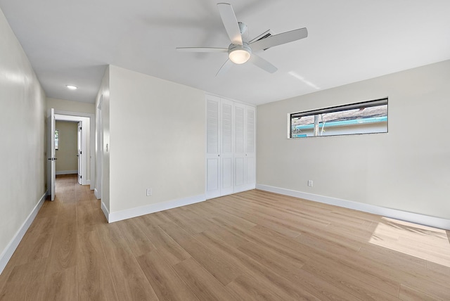 unfurnished bedroom with a closet, ceiling fan, and light hardwood / wood-style flooring