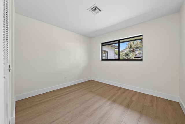 unfurnished room with light hardwood / wood-style flooring