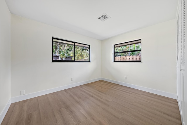 unfurnished room featuring light wood-type flooring