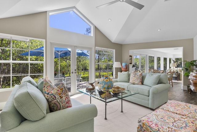 living room featuring ceiling fan, light wood-type flooring, high vaulted ceiling, and french doors