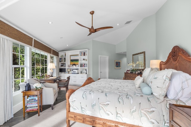 bedroom with ceiling fan, wood-type flooring, and vaulted ceiling