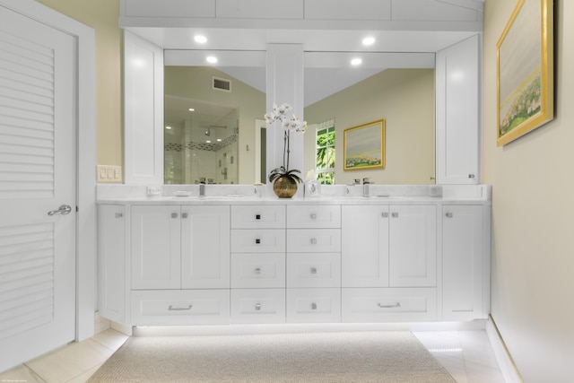 bathroom with vanity, tile patterned floors, and a shower with shower door