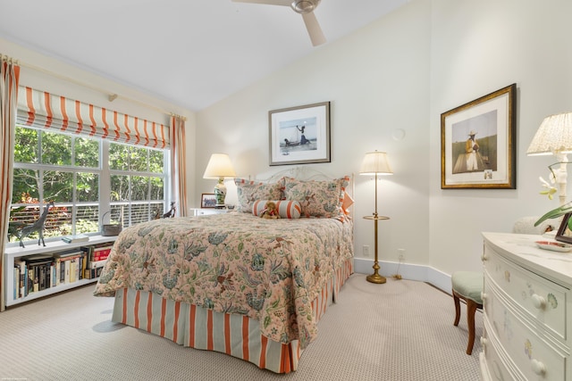 carpeted bedroom featuring ceiling fan and lofted ceiling