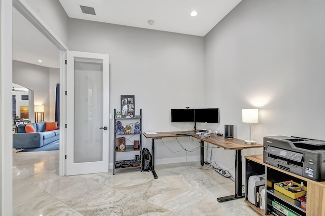 office space featuring ceiling fan and french doors