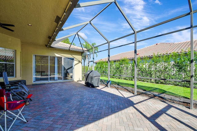 view of patio / terrace featuring a lanai and a grill